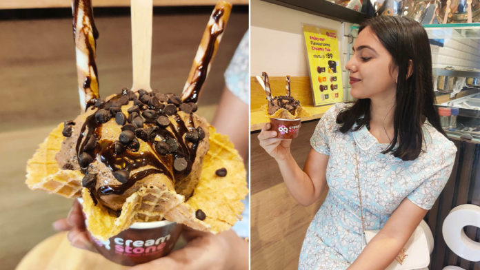 Try handmade ice creams at Cream Stone with toppings on a frozen cold stone